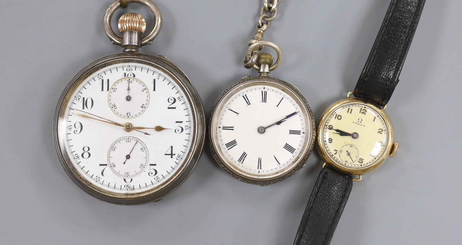 A lady's 9ct gold Omega manual wind wrist watch, a 935 white metal fob watch with albert and a silver open faced pocket watch.